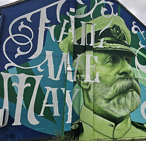 A mural on a wall of Captain John Smith, captain of the Titanic